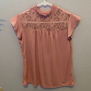 Mock neck shirt sleeve top.